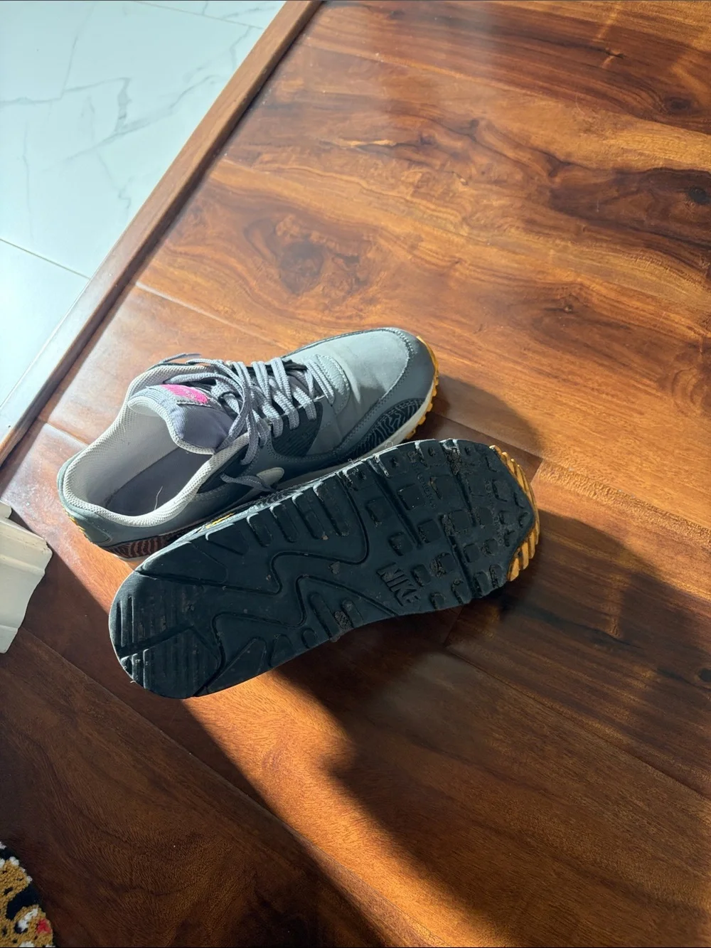 Nike Gray Sneakers with Pink Logo and Yellow Outsole
